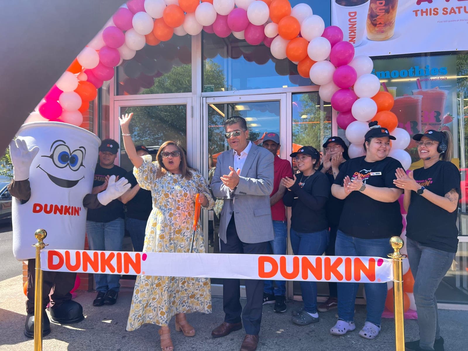 The K3K family and team cutting the ribbon at a Dunkin'/Baskin-Robbins grand opening