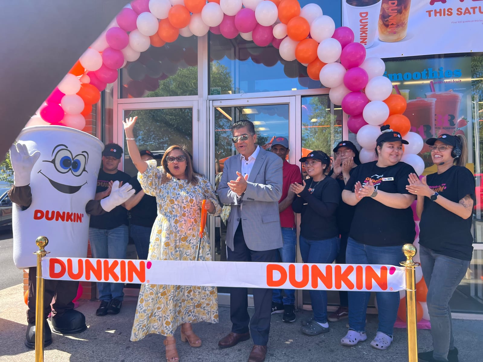 The K3K family and team cutting the ribbon at a Dunkin'/Baskin-Robbins grand opening